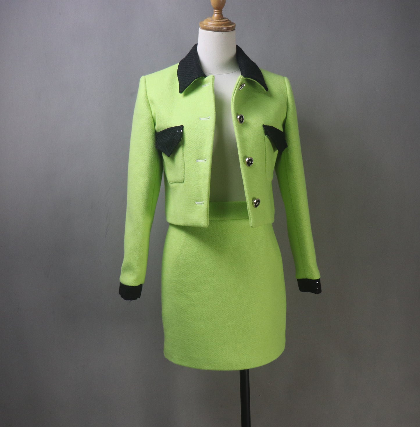 Make a bold statement with this custom-made lime green tweed suit, designed for elegance and confidence! Featuring a black sequined collar, this chic two-piece set includes a tailored jacket (available in cropped or full length) and a matching skirt, perfect for graduations, wedding guests, speech days, business meetings, and formal occasions.