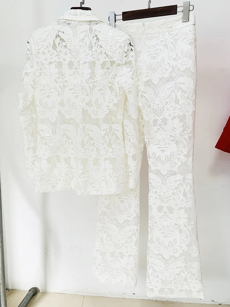 Crafted for sophistication, this ensemble is a stunning choice for weddings, ensuring you radiate grace on your special day. Elevate your birthday party look with the intricate lace details and bohemian flair of this exquisite suit. The versatile design seamlessly transitions from day to evening, making it ideal for a night out on the town. The dazzling sequins add a touch of glamour, ensuring you make a statement at any event.