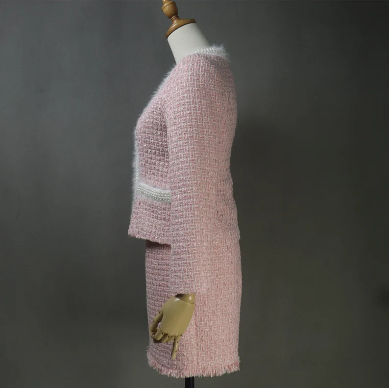 A pink fluffy coat designed for winter not only adds a pop of color to your wardrobe but also offers exceptional warmth and comfort. The fluffy texture not only looks stylish but also provides insulation against the chilly weather. With the option to customize the coat's design, you can choose a style that suits your personality, whether it's a sleek and tailored silhouette or a more relaxed and cozy fit