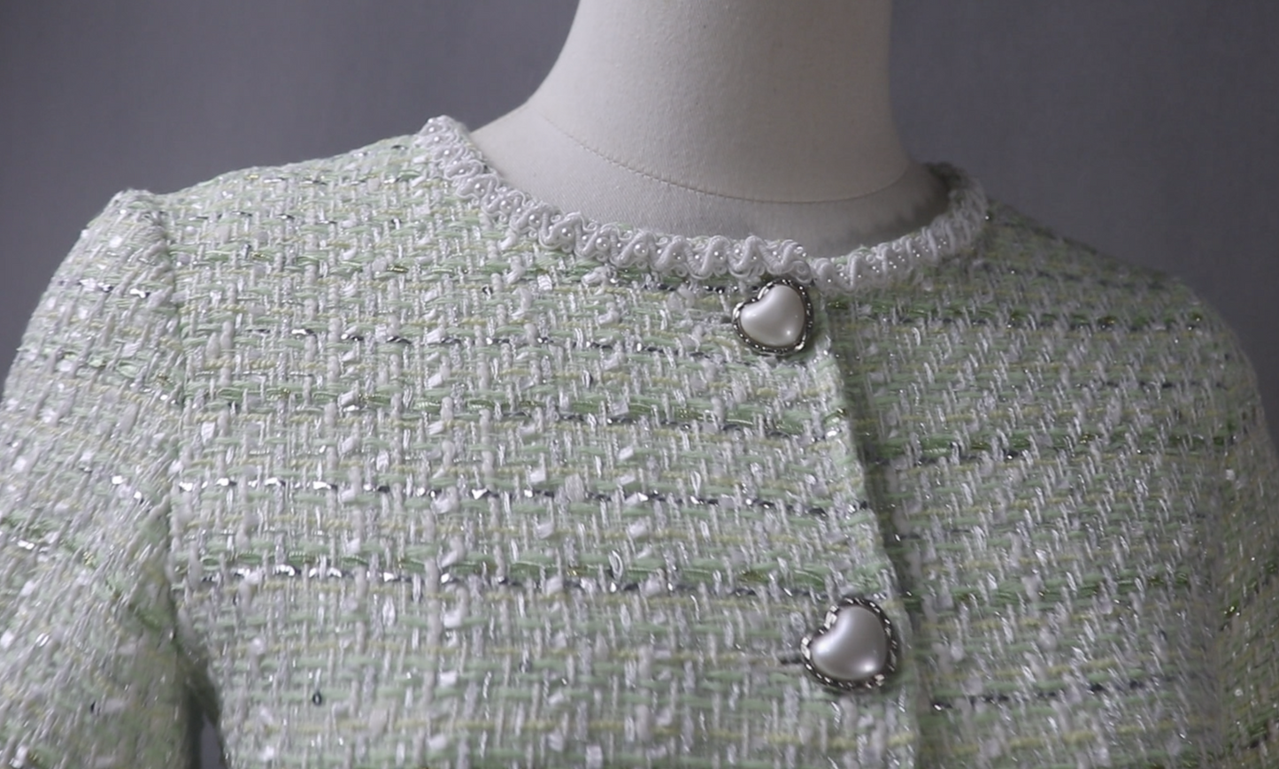A close-up photo to see the fabric, trims and buttons.