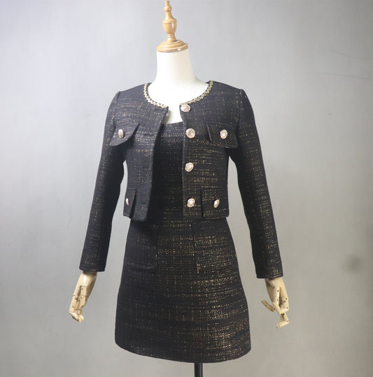 Front view of bespoke black tweed dress suit with gold threads on mannequin – cropped jacket and fitted dress set for plus size formal wear, office outfit, or evening event