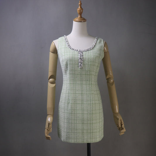 Front view of a custom green tweed dress with pearl trim and checked pattern, mini to midi length, sleeveless design, perfect for wedding guest, graduation, or formal summer party wear.