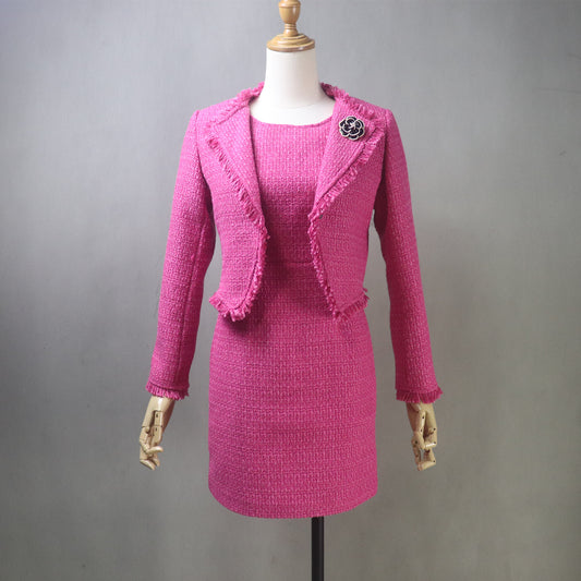 Front view of a fuchsia hot pink tweed dress paired with a matching cropped fringe jacket on a mannequin, showcasing a coordinated, elegant two-piece outfit.