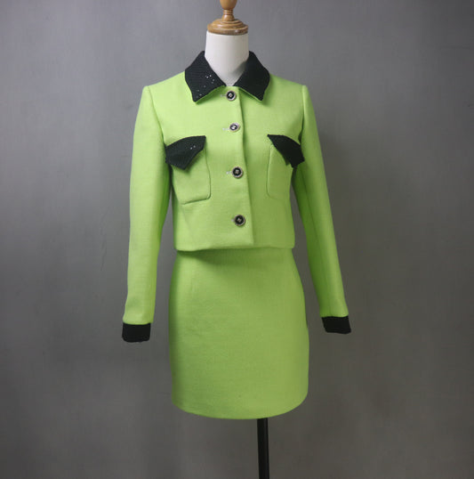 Make a bold statement with this custom-made lime green tweed suit, designed for elegance and confidence! Featuring a black sequined collar, this chic two-piece set includes a tailored jacket (available in cropped or full length) and a matching skirt, perfect for graduations, wedding guests, speech days, business meetings, and formal occasions.