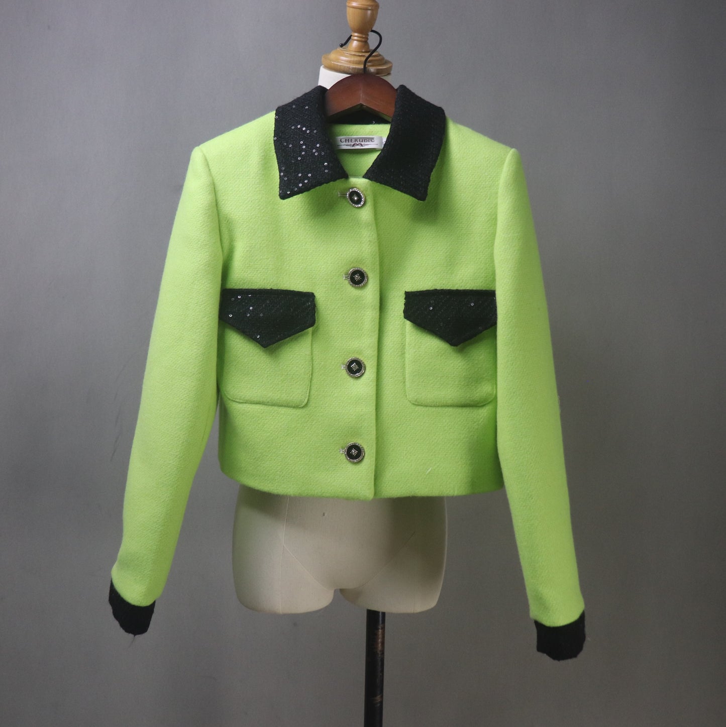 Make a bold statement with this custom-made lime green tweed suit, designed for elegance and confidence! Featuring a black sequined collar, this chic two-piece set includes a tailored jacket (available in cropped or full length) and a matching skirt, perfect for graduations, wedding guests, speech days, business meetings, and formal occasions.