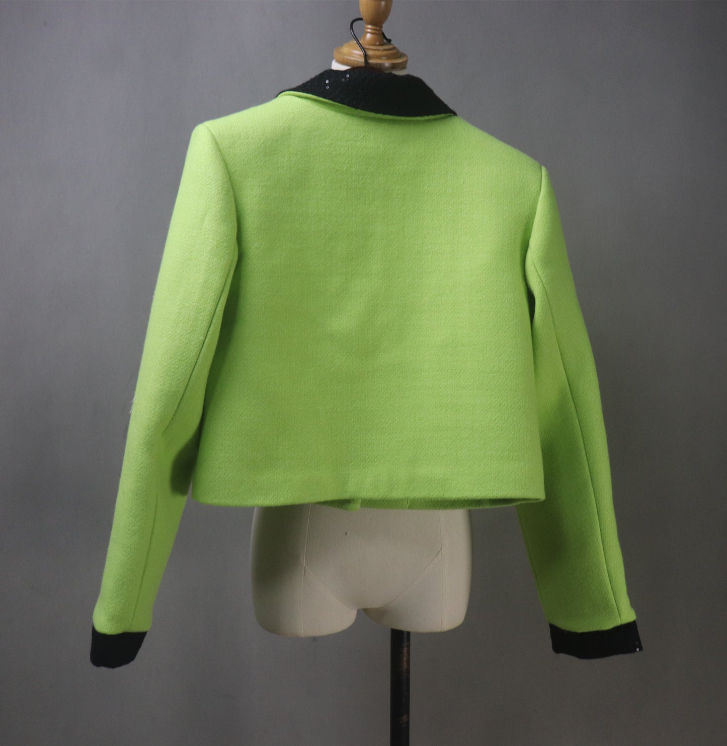 Make a bold statement with this custom-made lime green tweed suit, designed for elegance and confidence! Featuring a black sequined collar, this chic two-piece set includes a tailored jacket (available in cropped or full length) and a matching skirt, perfect for graduations, wedding guests, speech days, business meetings, and formal occasions.