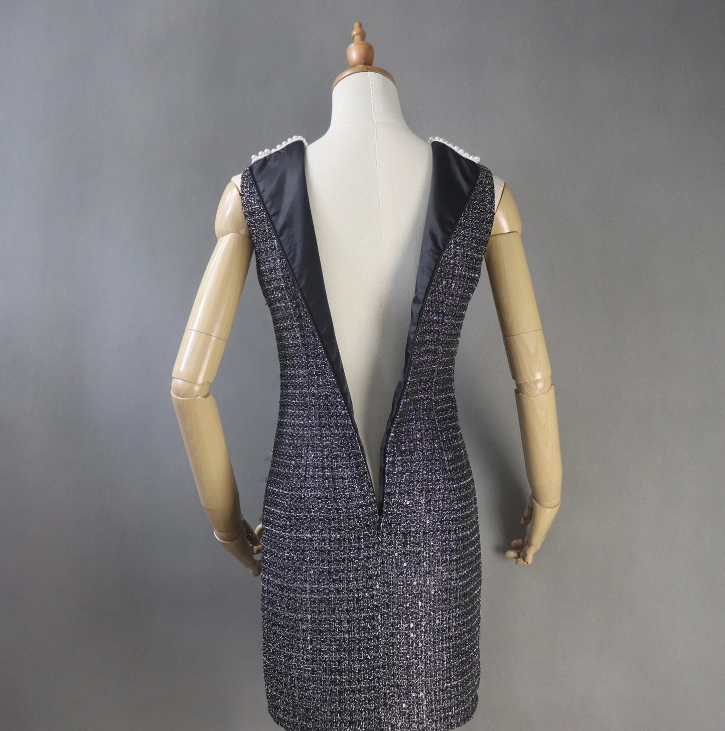 Womens Custom Made Pearls Decoration Sequinned Tweed Dress Black This dazzling FASHION Sequinned tweed little dress will stun everyone with its glamorous notes! This slim-fit black dress is made of a mid-weight tweed with dazzling lame accents, small sequins with white chiffon trims, and is lined with black satin. This dress also has a high neckline with trims, a sleeveless design