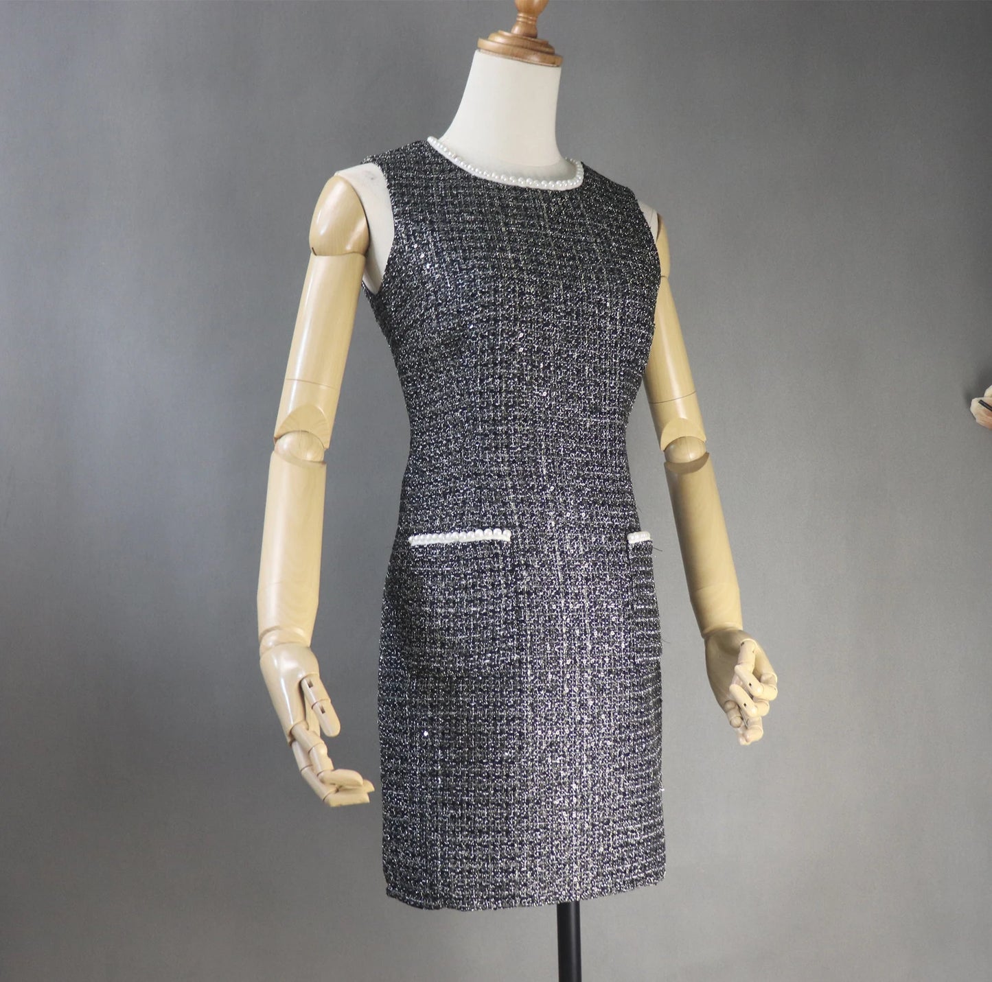 Womens Custom Made Pearls Decoration Sequinned Tweed Dress Black This dazzling FASHION Sequinned tweed little dress will stun everyone with its glamorous notes! This slim-fit black dress is made of a mid-weight tweed with dazzling lame accents, small sequins with white chiffon trims, and is lined with black satin. This dress also has a high neckline with trims, a sleeveless design