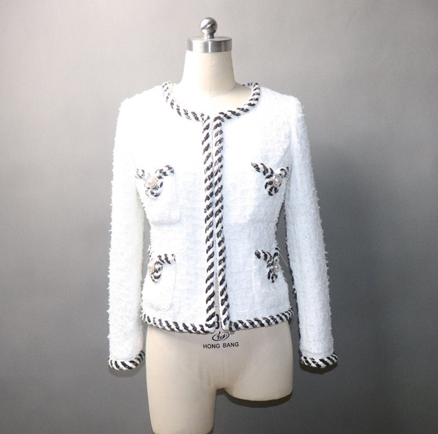 White Pearl Button Tweed Jacket Coat Women's Blazer UK CUSTOMER SERVICE! White Pearl Button Tweed Jacket Coat Women's Blazer - Pearl buttons with four front pockets. Tweed fabric with round neck and long sleeves. Dry clean.*Customized Size* All items are made to order. Please advise your height, weight and body measurements ( Bust, shoulder, Sleeves, Waist and Length etc). Our tailors will make the order for you! Materials: Wool blend