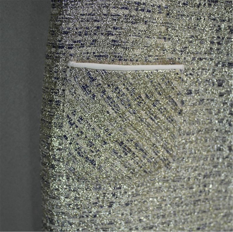 Step your way into any party this holiday season with their sliver Sparkly. Style with heels and a mini bag to complete the look. Fully lined ,front pocket and front pocket. This sleeveless silver sparkle dress is perfect matched with beautiful handbag or purse. Festive fashion at it s finest.