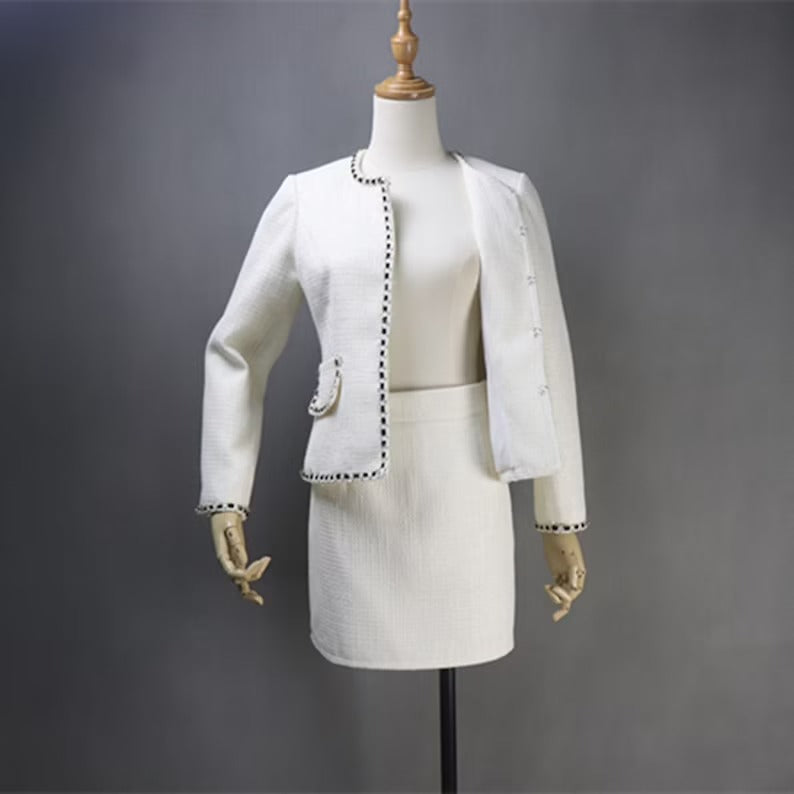 Women's White and Sparkle Trim Tweed Suit UK CUSTOMER SERVICE! Women's White and Sparkle Trim Tweed Suit - Suits and Coat have unique style. We offer Shorts, Skirts, Trousers for the suit. Our tailor will make as per customer requirement like with pocket, sleeveless, without pocket etc. All items are made to order with very experienced tailors. Please advise your height, weight and body measurements