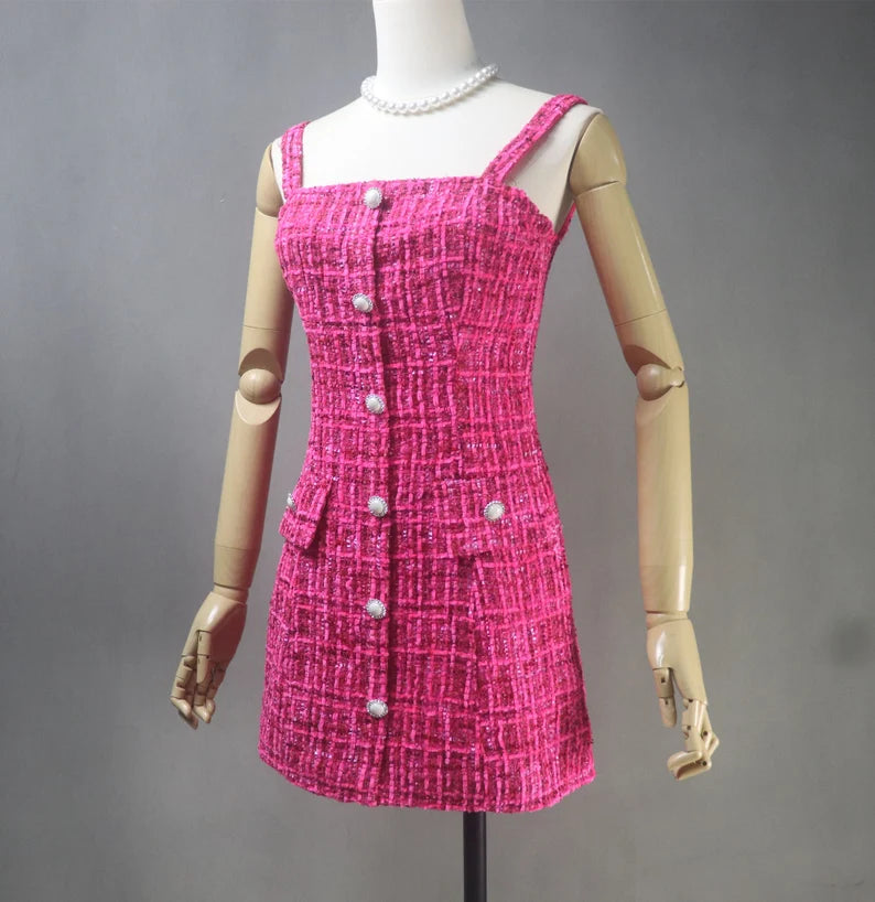 A hand-sewn tweed dress in hot pink color can be a stylish and unique addition to any woman's wardrobe. Tweed is a classic fabric that is known for its durability and texture, while hot pink adds a pop of color and modern flair to the dress. The length of the dress can vary depending on your preference and occasion. A mini-length dress can be a great option for a fun and casual look, while a knee-length dress can be more appropriate for formal or professional settings.