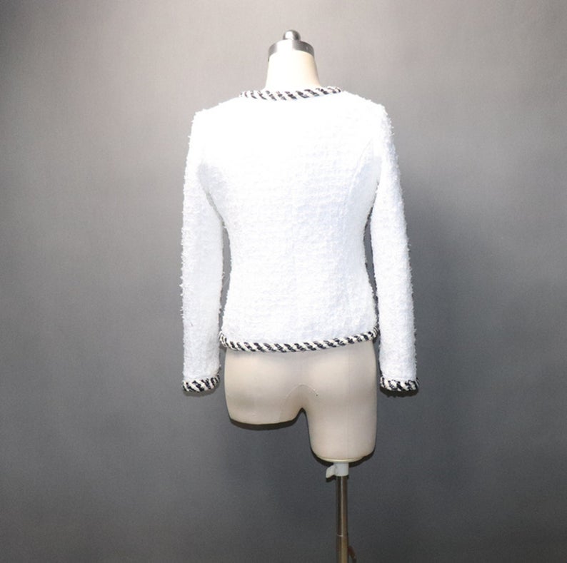 White Pearl Button Tweed Jacket Coat Women's Blazer UK CUSTOMER SERVICE! White Pearl Button Tweed Jacket Coat Women's Blazer - Pearl buttons with four front pockets. Tweed fabric with round neck and long sleeves. Dry clean.*Customized Size* All items are made to order. Please advise your height, weight and body measurements ( Bust, shoulder, Sleeves, Waist and Length etc). Our tailors will make the order for you! Materials: Wool blend