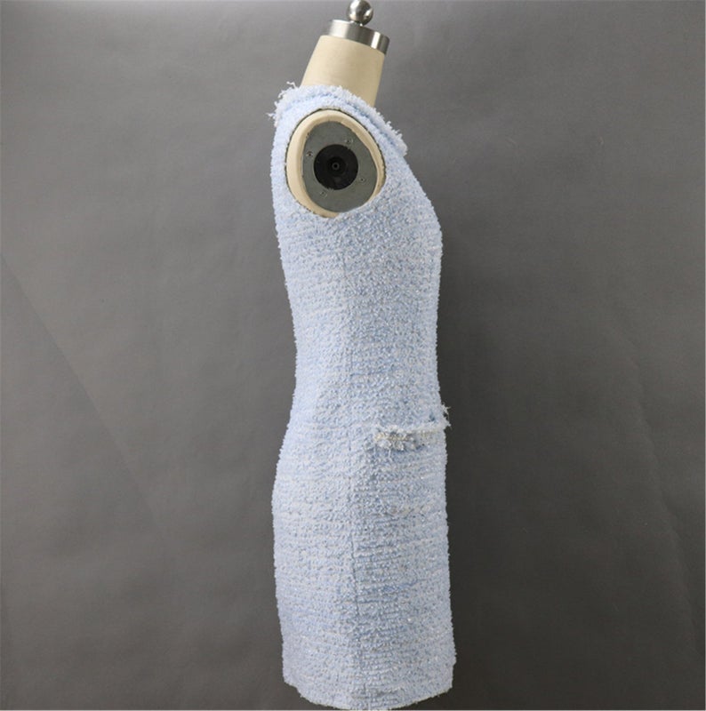 Tweed Sheath Dress Light Blue For Womens Custom Made UK CUSTOMER SERVICE! Tweed Sheath Dress Light Blue For Women's Custom Made - Round Neck with two pockets and Sleeveless. Fastening back zipper and Fringe detail. All items are made to order. Please advise your height, weight and body measurements ( Bust, shoulder, Sleeves, Waist and Length etc). Our tailors will make the order for you! Materials: Wool blend
