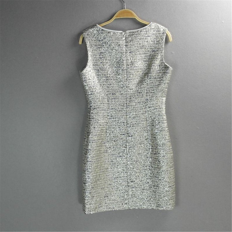 Step your way into any party this holiday season with their sliver Sparkly. Style with heels and a mini bag to complete the look. Fully lined ,front pocket and front pocket. This sleeveless silver sparkle dress is perfect matched with beautiful handbag or purse. Festive fashion at it s finest.