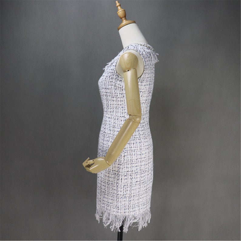 Women's Designer Inspired Custom Made Pearls Decoration Tassel Fringe Tweed Sheath Dress UK CUSTOMER SERVICE! Women's Designer Inspired Custom Made Pearls Decoration Tassel Fringe Tweed Sheath Dress - Custom made Tassel Fringe is modified as per customer requirement. Back zip closure , pearl Jewel neck, Short sleeves, Lined , 70% polyester, 24% acrylic, 3% wool, 3% other fibres. Dry clean.