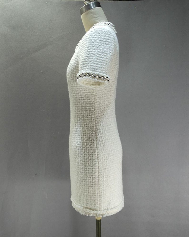 Sheath Custom Made Pearls White WOOL Tweed Dress UK CUSTOMER SERVICE! Sheath Custom Made Pearls White WOOL Tweed Dress - Round neck and arm with gold and pearl button designed. Knee Length Sheath Dress. Our tailor will make sharp body measurement and look perfect fit. You will love this casual sheath dress! It's a must-have piece in your wardrobe with its simple silhouette and slight A-line shape.
