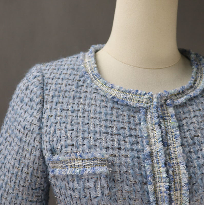 Women's Custom Made Tassel Light Blue Tweed Blazer + Skirt Suit UK CUSTOMER SERVICE! Women's Custom Made Tassel Light Blue Tweed Blazer + Skirt Suit - Custom made suit with front pocket and long sleeves, Our tailor will happy to make exact body measurement , as per customer requirement. All items are made to order. Please advise your height, weight and body measurements ( Bust, shoulder, Sleeves, Waist and Length etc). Our tailors will make the order for you! Materials: Wool blend