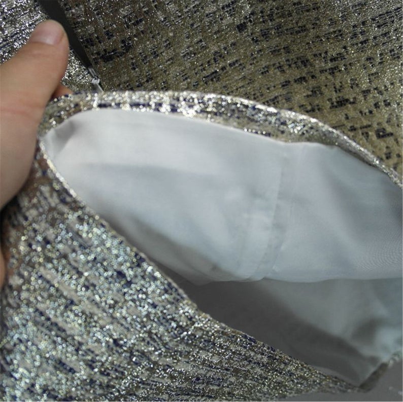 Step your way into any party this holiday season with their sliver Sparkly. Style with heels and a mini bag to complete the look. Fully lined ,front pocket and front pocket. This sleeveless silver sparkle dress is perfect matched with beautiful handbag or purse. Festive fashion at it s finest.