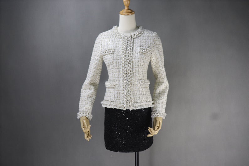 Tweed Pearls Sparkle Thread Blazer + Skirt Suit UK CUSTOMER SERVICE! Tweed Pearls Sparkle Thread Blazer + Skirt Suit - Fashion elements combine classic design. Great for teens or some young ladies dressing the classic, retro, casual and stylish look. Dress designed with pearl buttons , round neck and little tassel. This can be worn all suitable occasion. We have multi-coloured suits white top and black bottom, blue ,pink, black.