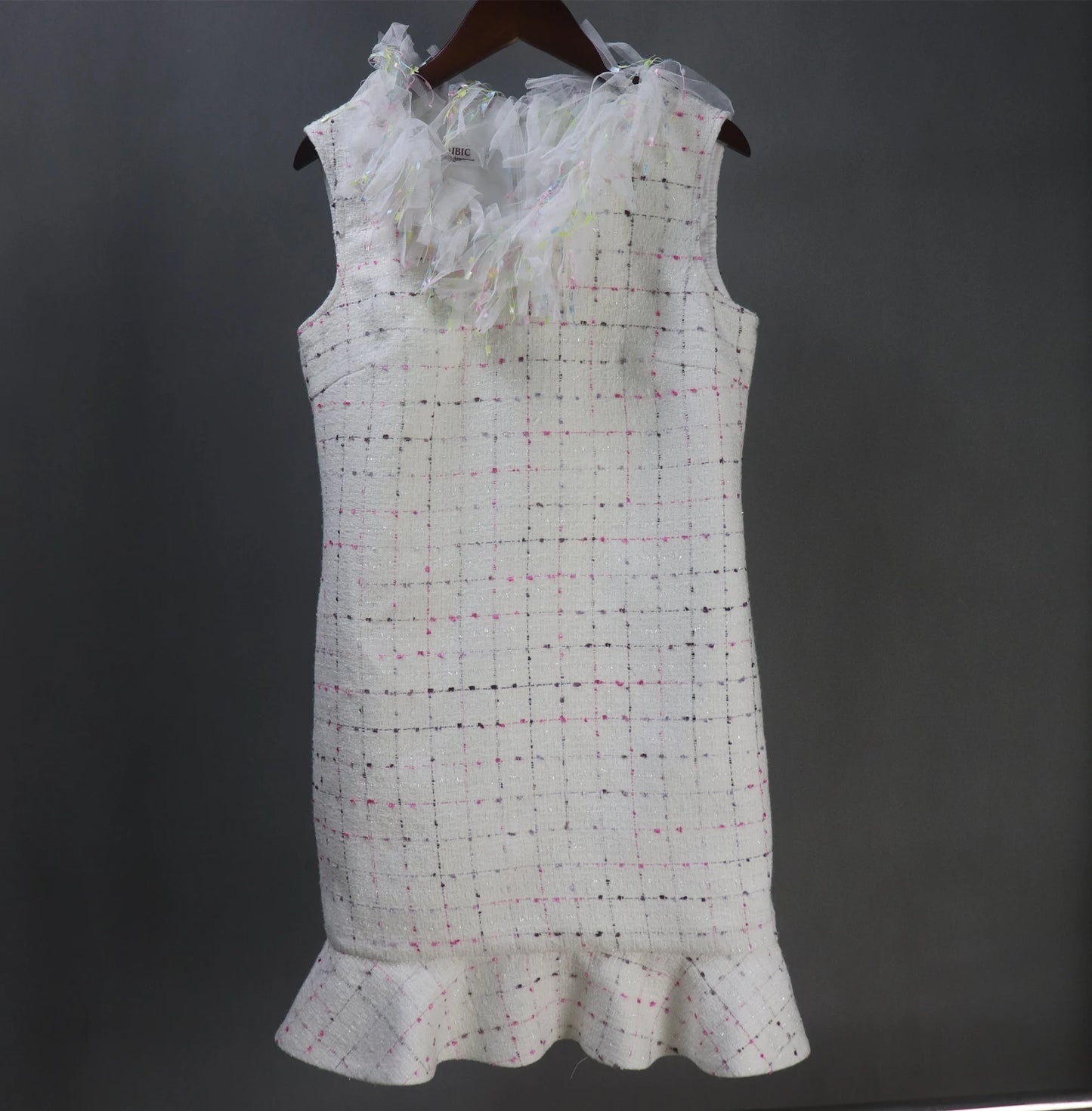 Tailor Custom Made Ruffle Neck / Collar Multi-color Fitted Tweed Mini/ Midi/ Long Ruffle Hem Fishtail Dress, fashion cloth for women made by our tailor. Custom made ruffle with multicolour checked pattern and ruffle design. Fishtail design with sleeveless ,can worn for drama shows, party wear, ceremony. Bespoke women's apparel gives its well-known women's tailoring a delectable feminine twist. All of our products are handcrafted to order.