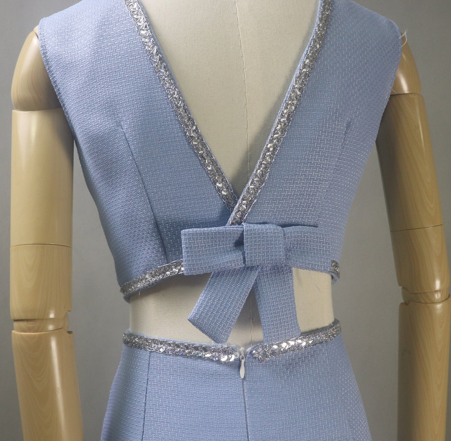Close Up View of the dress. You can see the fabric, Deep V cut on the back and Trims clearly.