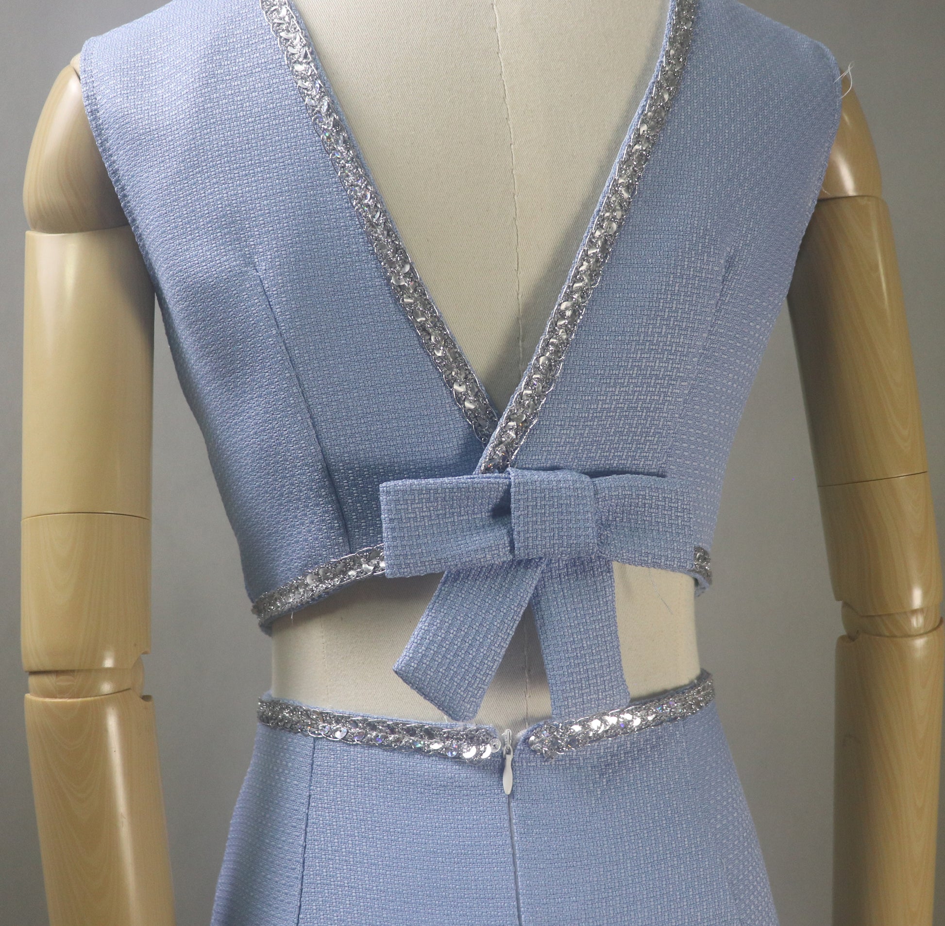 Close Up View of the dress. You can see the fabric, Deep V cut on the back and Trims clearly.