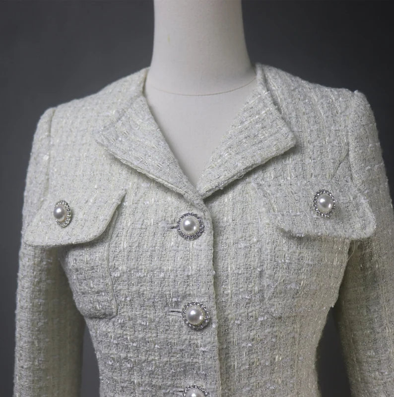 Tailor-made tweed women's clothing with pearl button designs offers a blend of traditional craftsmanship, personalization, and timeless elegance. It's a fashion choice that celebrates individuality and attention to detail, resulting in clothing that is both stylish and comfortable.