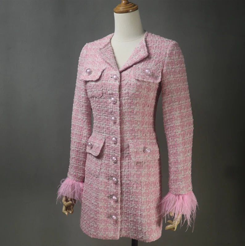 Women's custom-made tweed apparel with pearl button designs combines traditional workmanship, individualization, and timelessness. It's a fashion decision that honours uniqueness and attention to detail and produces attire that is both fashionable and cosy.