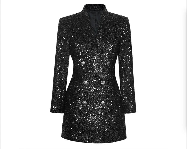 The Women's Silver Buttons Fully Sequinned Mid-length Black Jacket Blazer Coat is a show-stopping performance costume designed to captivate and dazzle. This mid-length black jacket is adorned with intricate silver sequins, creating a glamorous and eye-catching look that demands attention on stage or at any performance. The silver buttons add a touch of elegance and sophistication to the ensemble, enhancing its overall appeal.
