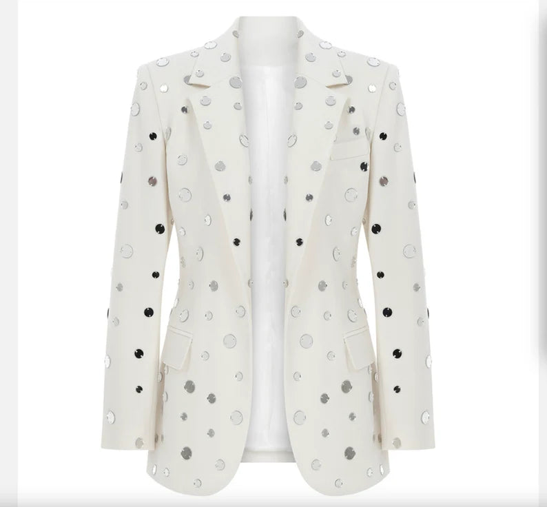 The "Small Mirrors Decoration White Fitted Blazer Jacket" is a dazzling embodiment of elegance and individuality. With its meticulously crafted design, adorned with small mirrors that glisten and shimmer, it's a statement piece that exudes confidence and creativity.  For a Taylor Swift concert, this jacket is the perfect choice to shine in the crowd, catching the stage lights and reflecting the energy of the performance.