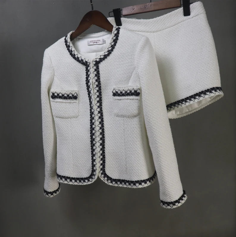 Step into elegance and sophistication with this tailor-made White Tweed Jacket Suit, the epitome of timeless style and versatility. This exquisite suit ensemble offers a myriad of options to suit various occasions, making it an ideal choice for everything from weddings to graduation ceremonies, speech days, and formal events.