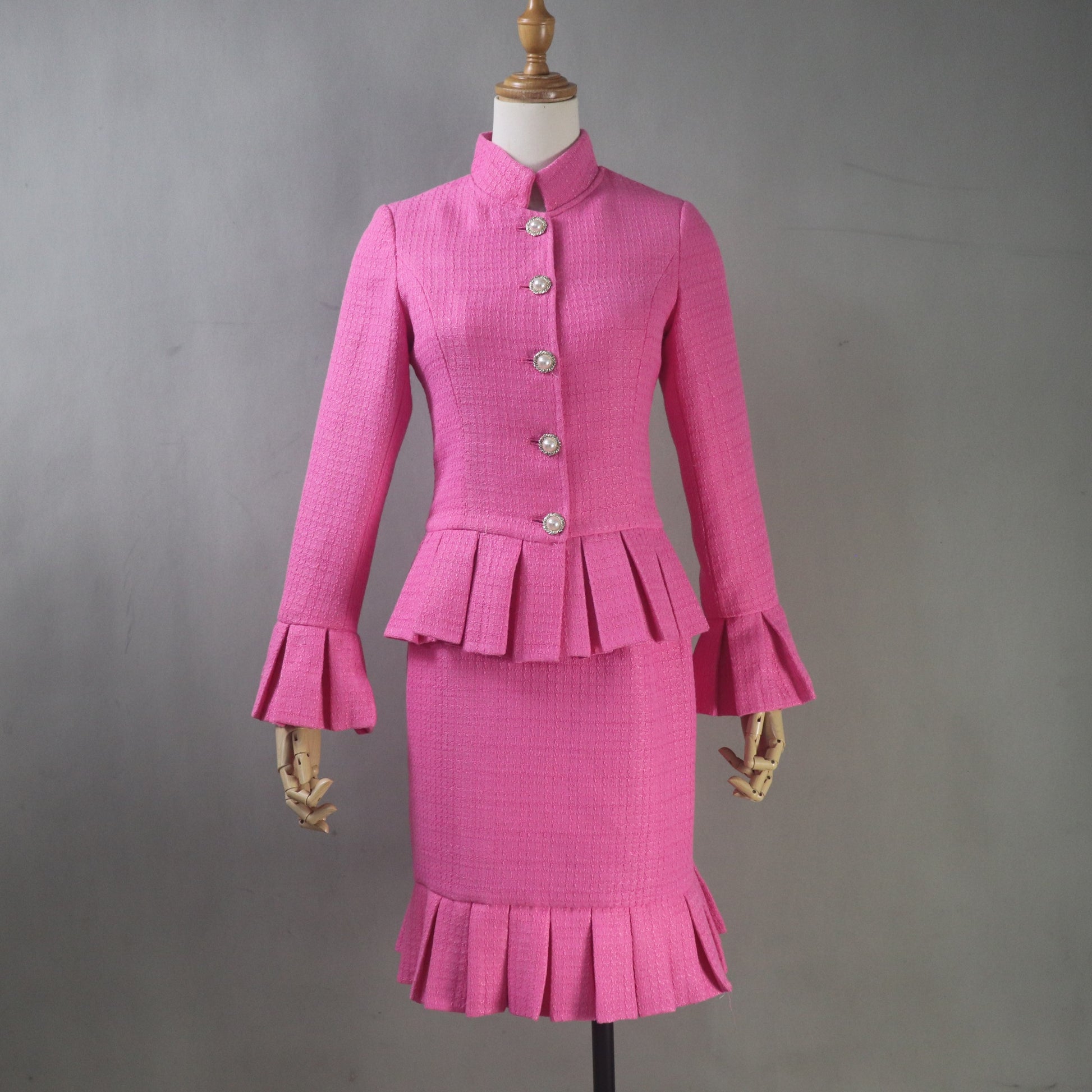 Made-to-measure women's pink tweed suit customized to any size, length, color, and fabric.