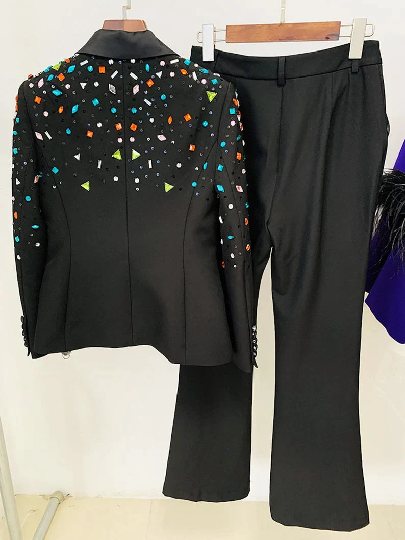 This timeless Women Black Hand Made Colorful Stones Embroidery Blazer + Mid-High Rise Flare Trousers Pantsuit Suit is perfect for any occasion. With its intricate hand-embroidered stones and sleek black blazer, this luxe two-piece set exudes elegant sophistication and is sure to make a lasting impression. Ideal for both day and night celebrations, it is the perfect reflection of refined luxury.