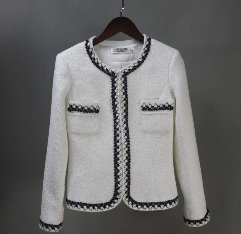 Step into elegance and sophistication with this tailor-made White Tweed Jacket Suit, the epitome of timeless style and versatility. This exquisite suit ensemble offers a myriad of options to suit various occasions, making it an ideal choice for everything from weddings to graduation ceremonies, speech days, and formal events.