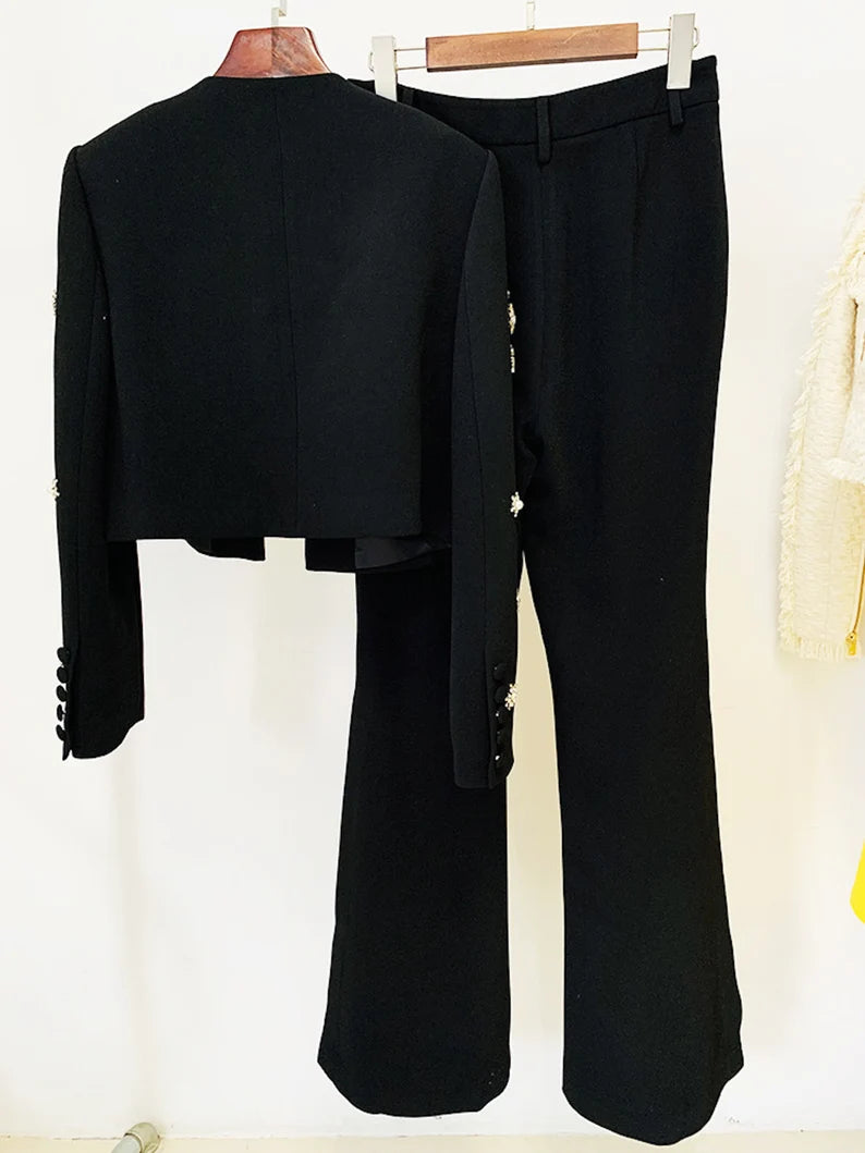 Elevate your style with our exquisite Women's Hand-Sewn Pearls Jewelry Crop Blazer Jacket + Flare Trousers Side Slit Pants Suit. This sophisticated ensemble seamlessly combines the luxury of hand-sewn pearls with a modern silhouette, making it the perfect choice for weddings, birthdays, and any special occasion where you want to make a stylish and memorable statement.