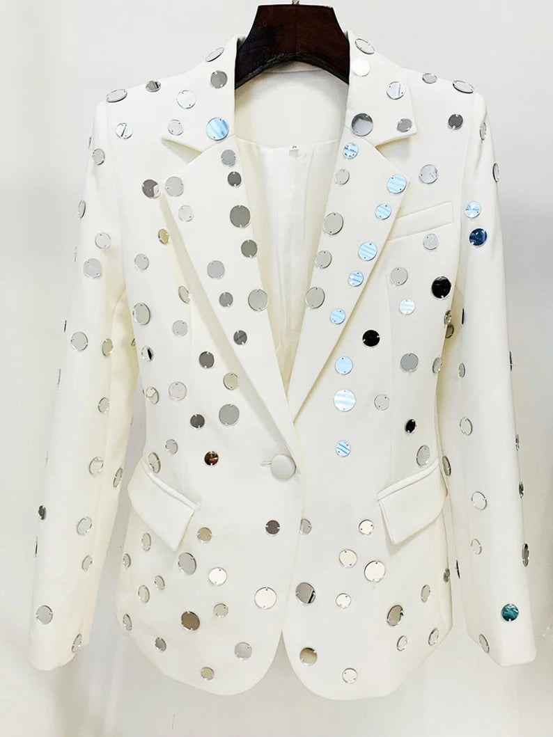 The "Small Mirrors Decoration White Fitted Blazer Jacket" is a dazzling embodiment of elegance and individuality. With its meticulously crafted design, adorned with small mirrors that glisten and shimmer, it's a statement piece that exudes confidence and creativity.  For a Taylor Swift concert, this jacket is the perfect choice to shine in the crowd, catching the stage lights and reflecting the energy of the performance.