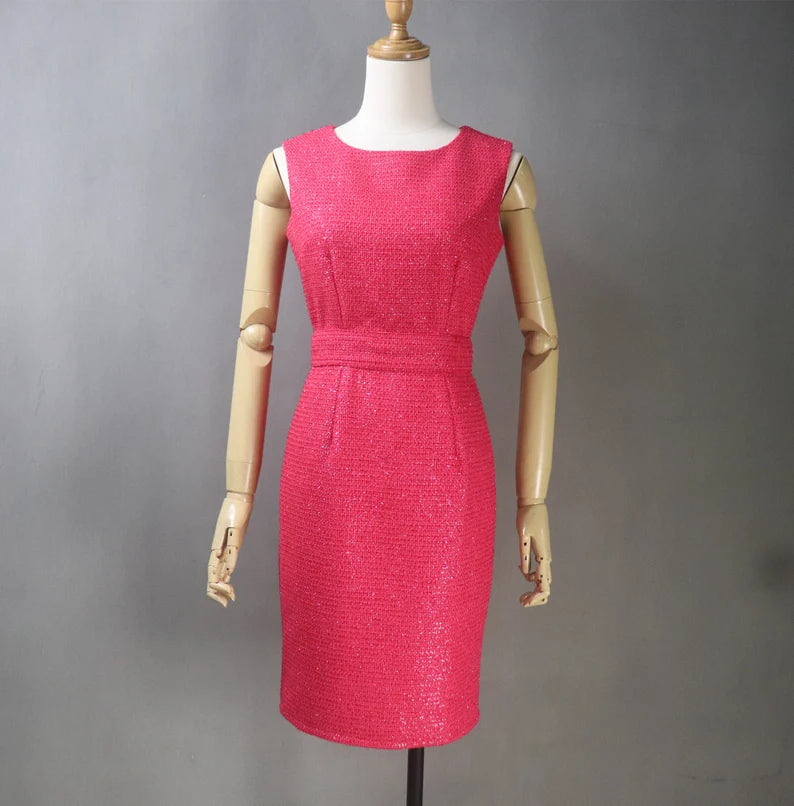 It's not just a dress; it's an expression of your personality. Elevate your fashion game with a red tweed dress that's tailored to perfection, enhancing your natural beauty and embracing your individuality. Our red tweed dress with custom tailoring ensures you are the star of every gathering.  Embrace the fusion of tradition and contemporary fashion with our red sheath dress. 