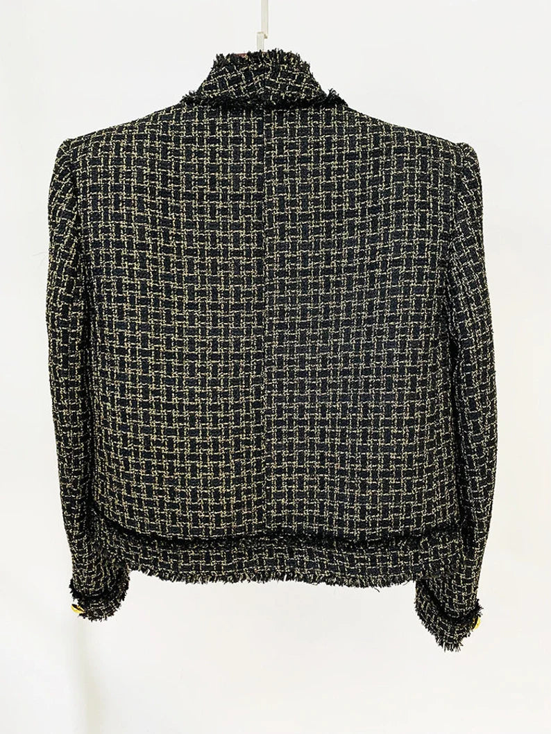 The Women's Black Tweed Jacket Coat Blazer is a custom-made work of elegance that highlights the wearer's grace and sense of style. The traditional tweed fabric is given a feminine touch by the delicate black colour, resulting in a jacket that expertly combines sophistication and a contemporary style. This well fitted jacket coat is a flexible addition to any woman's collection because of its tailored fit, which flatters the silhouette.