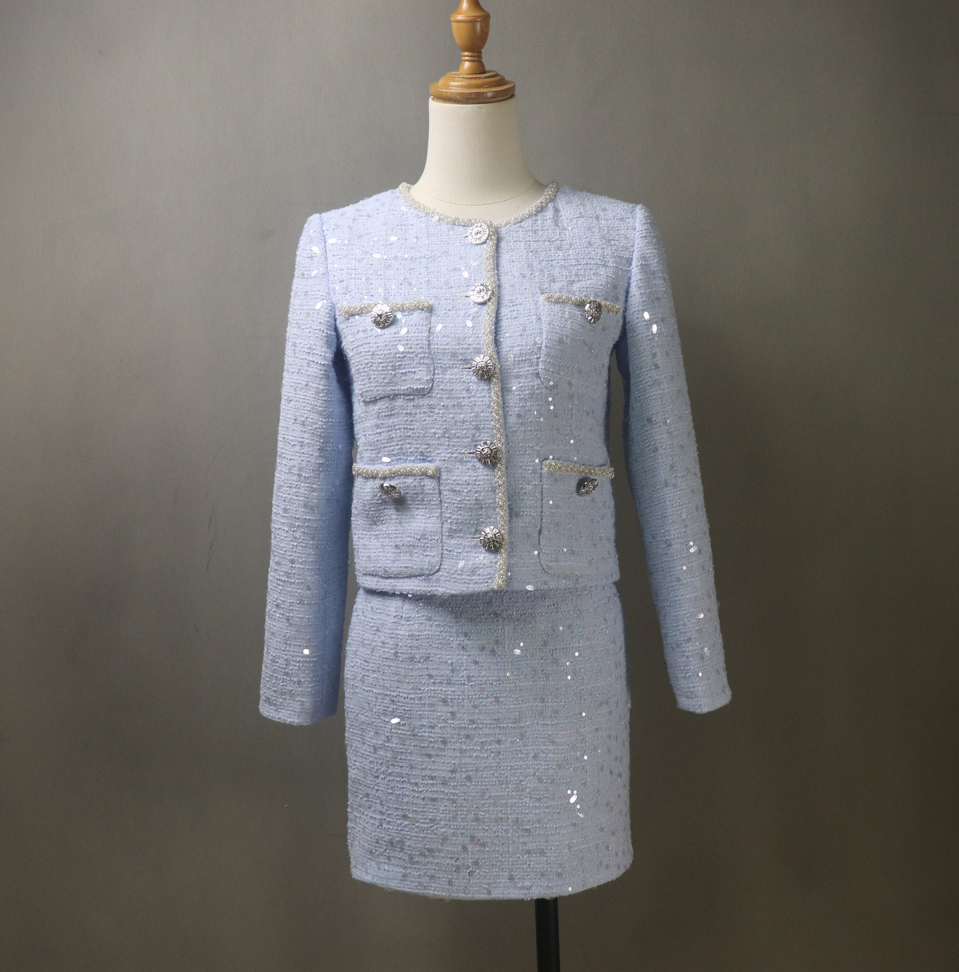 Elevate your style with this stunning Blue Tweed Skirt Suit, intricately adorned with eye-catching big sequins for a touch of glamour. Perfect for the Autumn and Winter seasons, this custom-made suit combines classic elegance with a modern twist, making it an ideal choice for various special occasions.