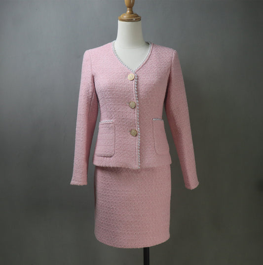 Step into timeless elegance with our Custom Pink Tweed Skirt Suit adorned with pearls. Tailored to perfection, this chic suit is designed to make you feel confident and sophisticated for any occasion. Whether you’re attending a formal event, a wedding, graduation, or delivering a speech, this versatile suit is your go-to choice.