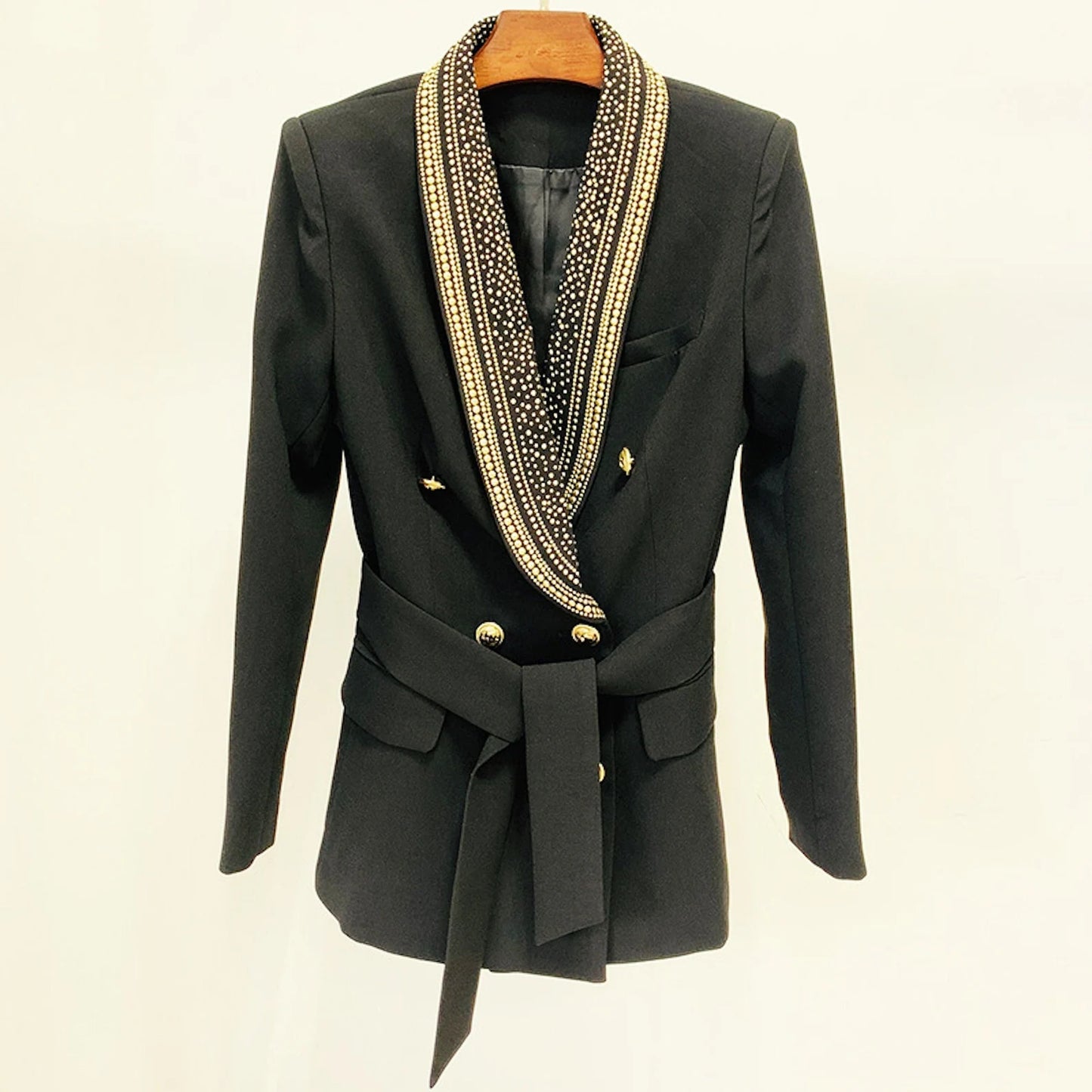 Black Blazer Women's Shawl Collar Belted Mid- Length Studded   Jacket with a belted waist, a shawl collar, a double-breasted closure, buttoned cuffs, side pockets, a breast pocket, and a snap-button closure. Wearable for business meetings, everyday wear, formal dates, office work, vacation, and outdoor activities. The simple and Shawl Collar neck line is a classic fashion design.