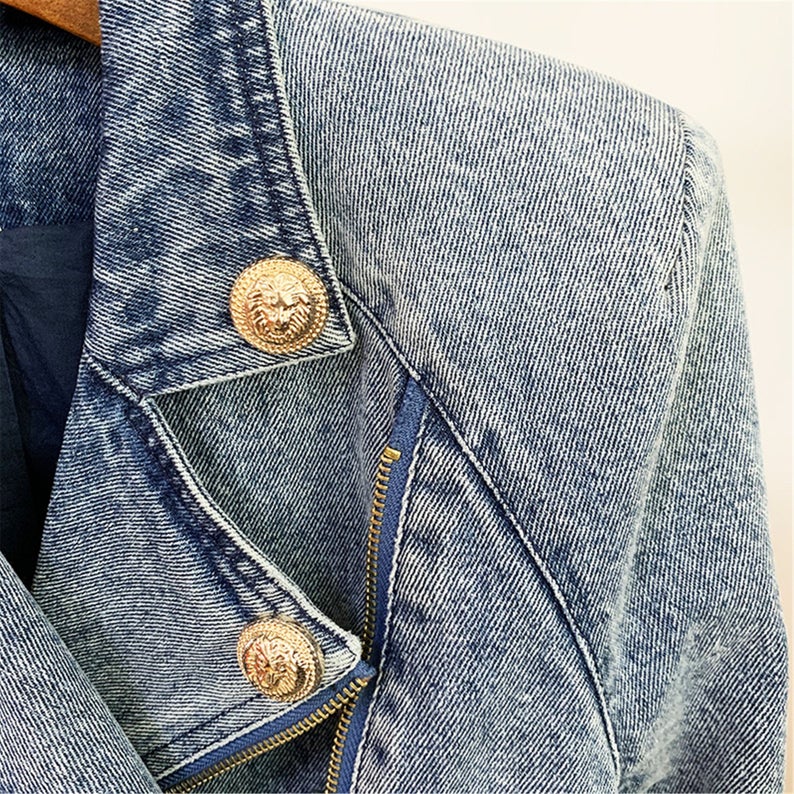 Women's Luxury Designer Inspired Denim Golden Buttons Biker Jacket Blazer  UK CUSTOMER SERVICE! Women's Luxury Designer Inspired Denim Golden Buttons Biker Jacket Blazer - light blue jacket is crafted from cotton denim that’s faded and gently distressed around the edges for a vintage look. It’s Italian made to a relaxed silhouette with chest patch  a zigzag-topstitched buttoned placket and buckled belt arm .