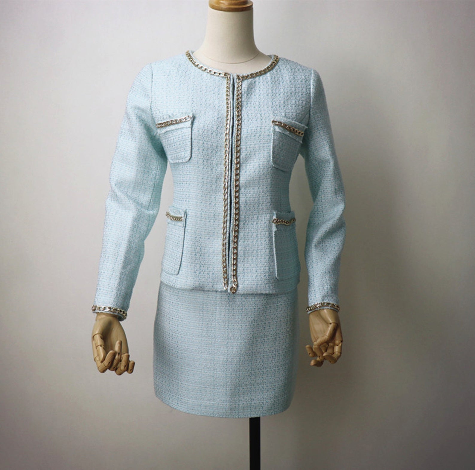 Tailor Made Suits for Women Chain Decoration Tweed Blazer + Skirt Suit - Sky Blue suit and skit with round neck and chain decorated for arm and pocket. We customize everything according to your measurements because we want to make sure your suit fits you perfectly. We create garments that are a perfect fit and deliver it to your door.