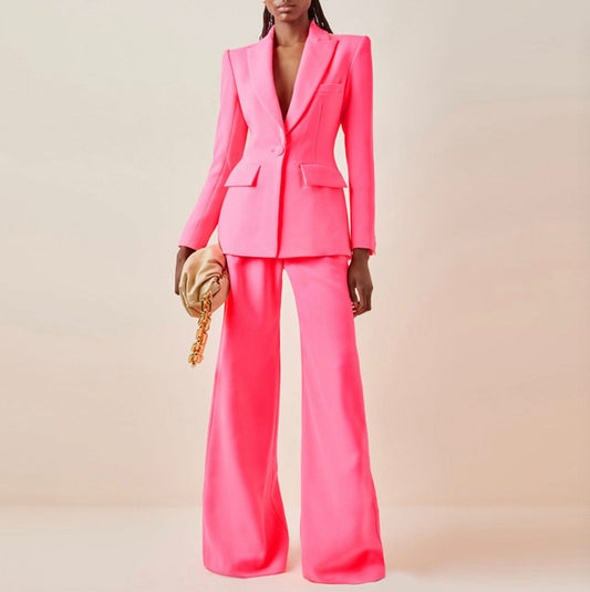 Elevate your style with our Women's Hot Pink Fitted Blazer and Flare Trousers Pants Suit. This chic ensemble seamlessly blends sophistication and trendiness, making it perfect for any fashion-forward woman. The hot pink hue adds a bold and playful touch, while the fitted blazer and flare trousers create a flattering silhouette. Embrace confidence and stand out at any occasion with this statement-making suit