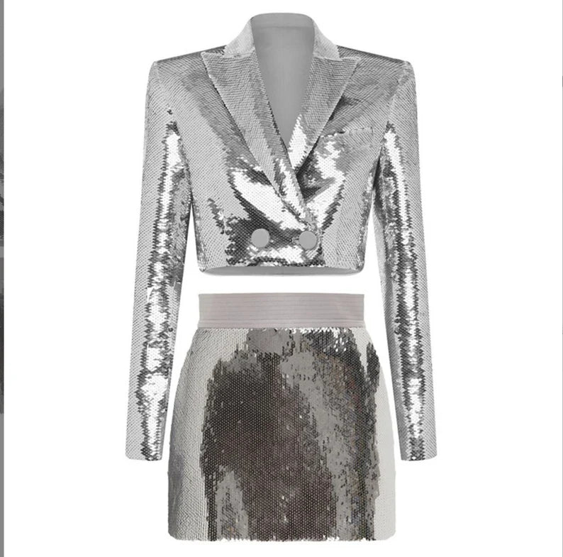 Women Bling Bling Silver Sequinned Crop Blazer Jacket + Mini Skirt Suit  This Bling bling fully sequinned suit will make you a star in any special event such as party, clubbing, stage performance and so on. If you are looking for something extraordinary and eye-catching, this is the perfect outfit for you! The blazer jacket is designed with full sequinned material, cropped length and V-neck collar. The mini skirt is designed with fully sequinned material too, high waist and mini length.
