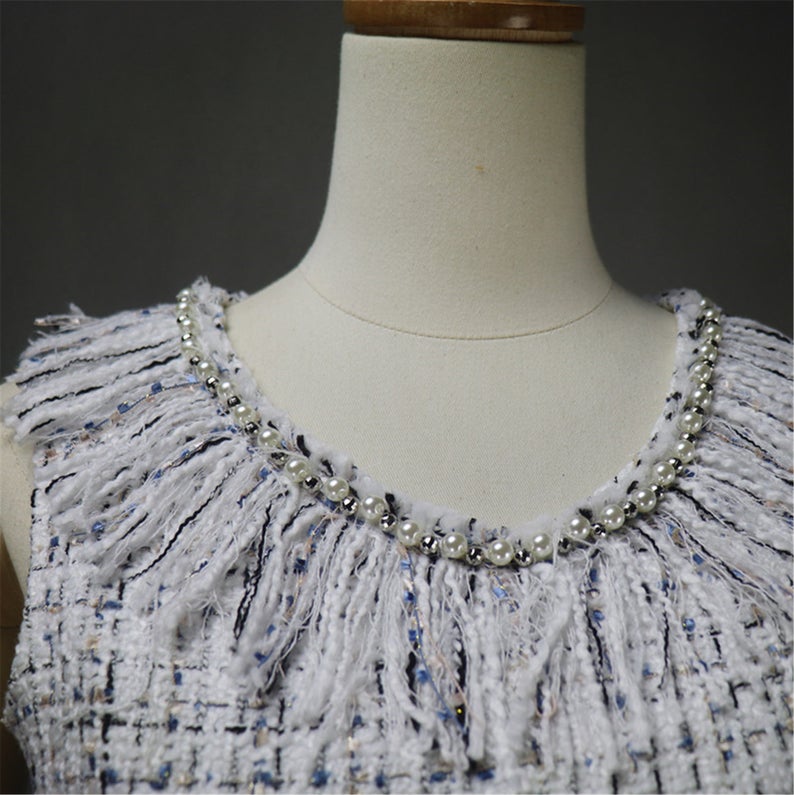 Women's Designer Inspired Custom Made Pearls Decoration Tassel Fringe Tweed Sheath Dress  UK CUSTOMER SERVICE! Women's Designer Inspired Custom Made Pearls Decoration Tassel Fringe Tweed Sheath Dress - Custom made Tassel Fringe is modified as per customer requirement. Back zip closure , pearl Jewel neck, Short sleeves, Lined , 70% polyester, 24% acrylic, 3% wool, 3% other fibres. Dry clean.