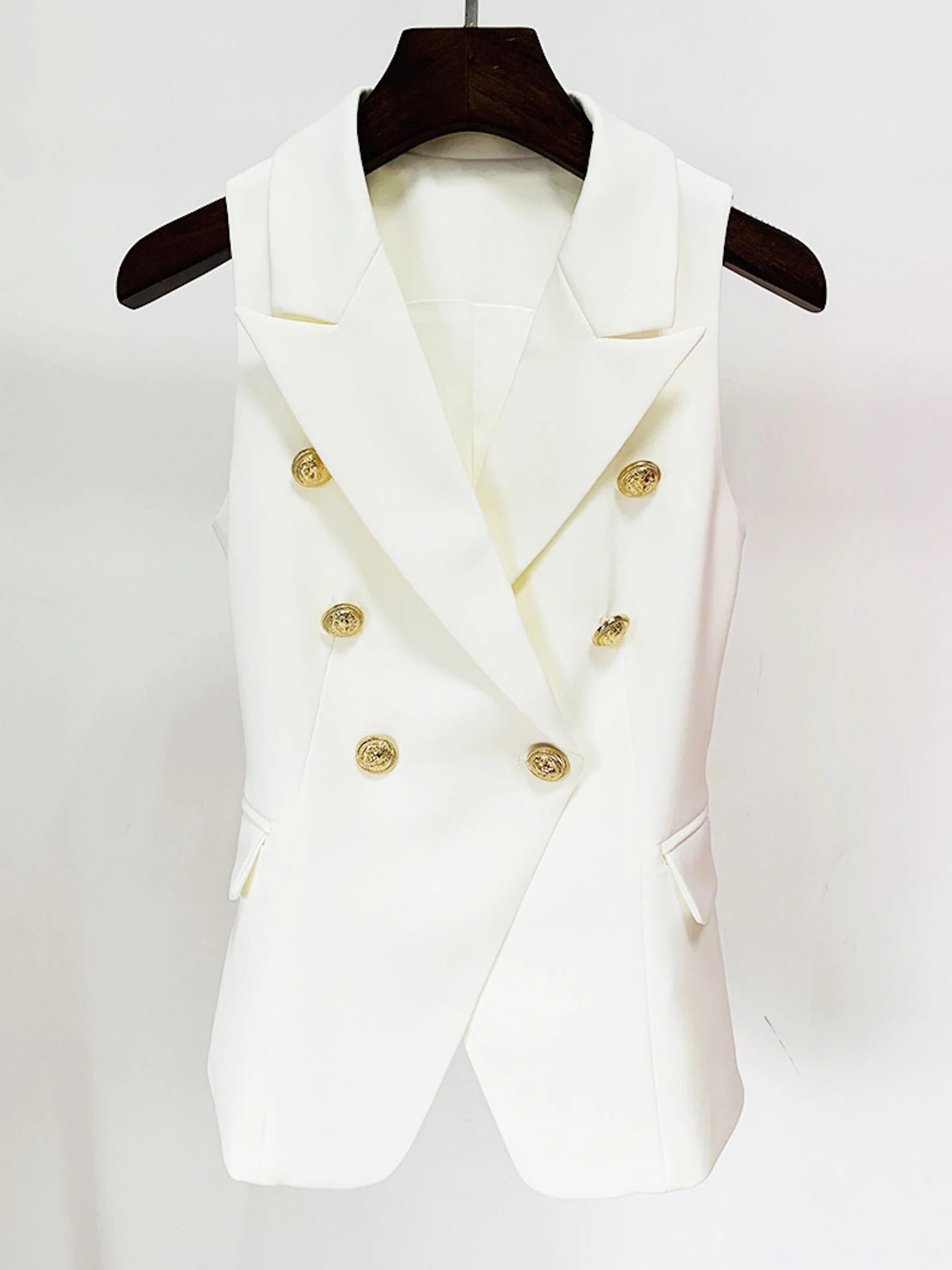 Women's Golden Lion Buttons Fitted Blazer Style Vest White  Gold-tone buttons provide a touch of nautical appeal to this blazer, while the ponte fabric gives it a comfortable yet polished style for classy to elegant for your professional everyday office work. Casual, work, business travels, meetings, formal, dinner dates, hangouts, and other special events are all appropriate occasions.